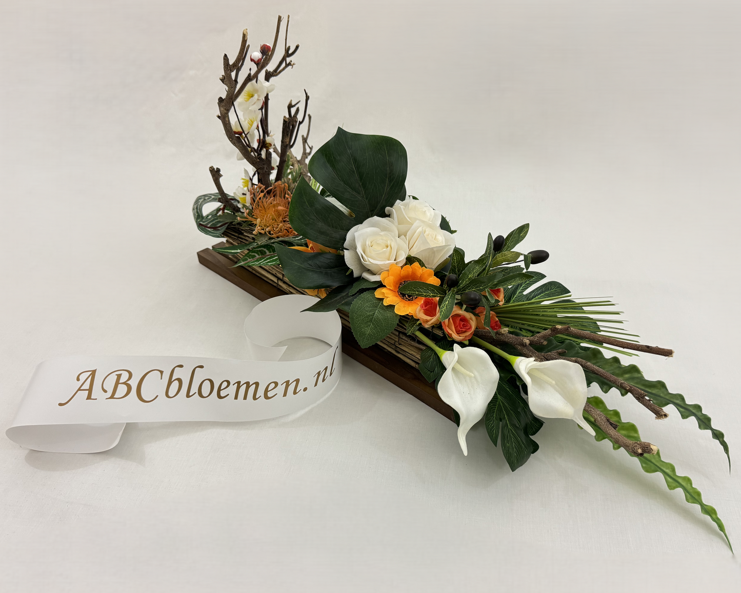 langwerpig rouwstuk met hout