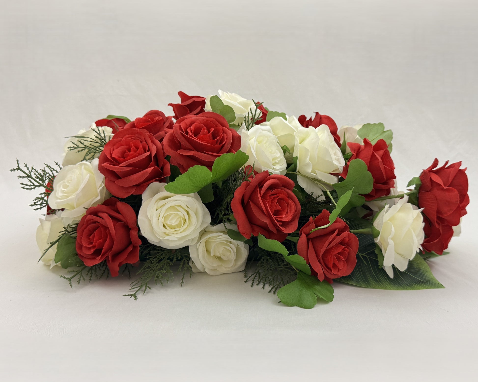 zij-aanzicht rouwboeket rozen