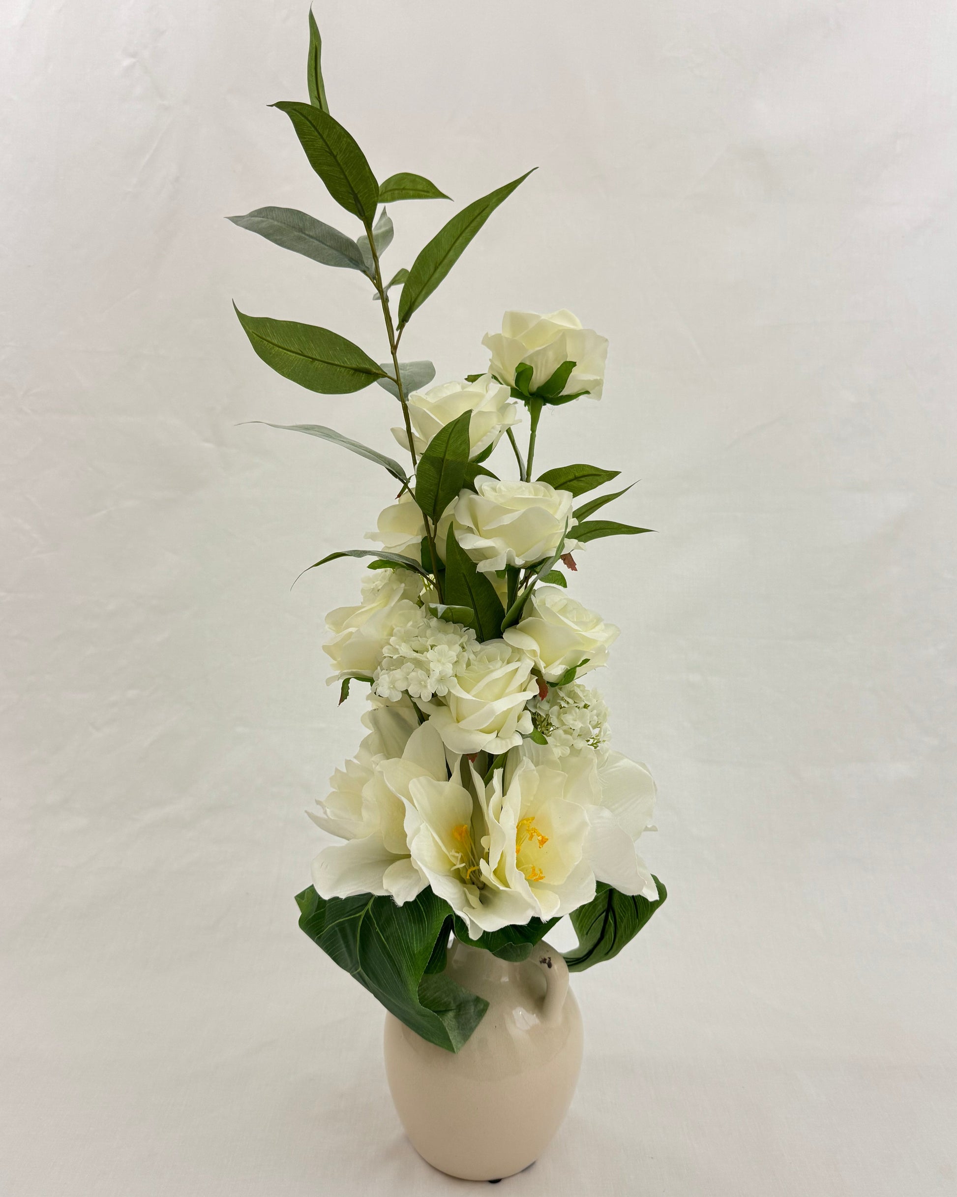 Wit rouwstuk in lief vaasje