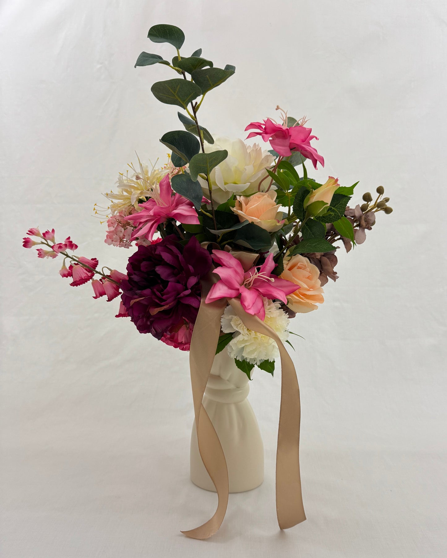 rouwboeket roze wit in vaas