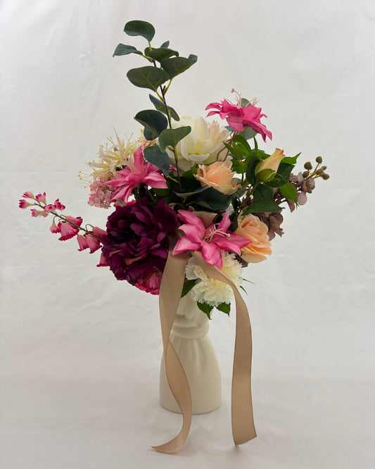 rouwboeket roze wit in vaas