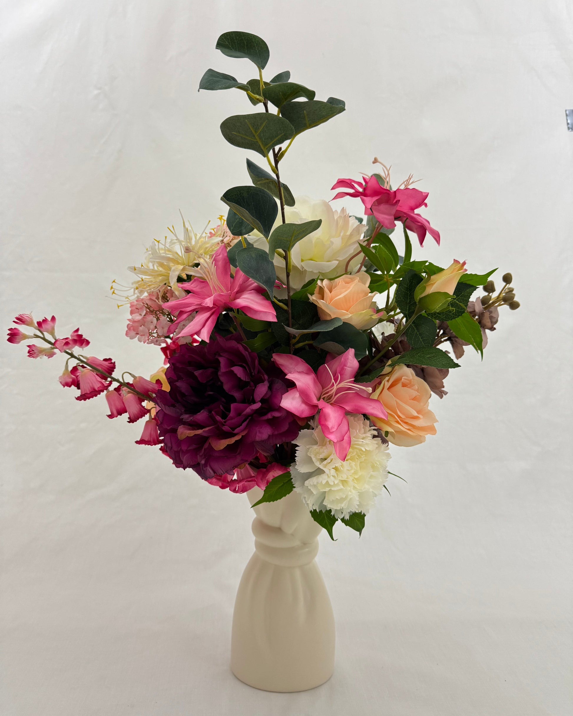 rouwboeket roze wit in vaas