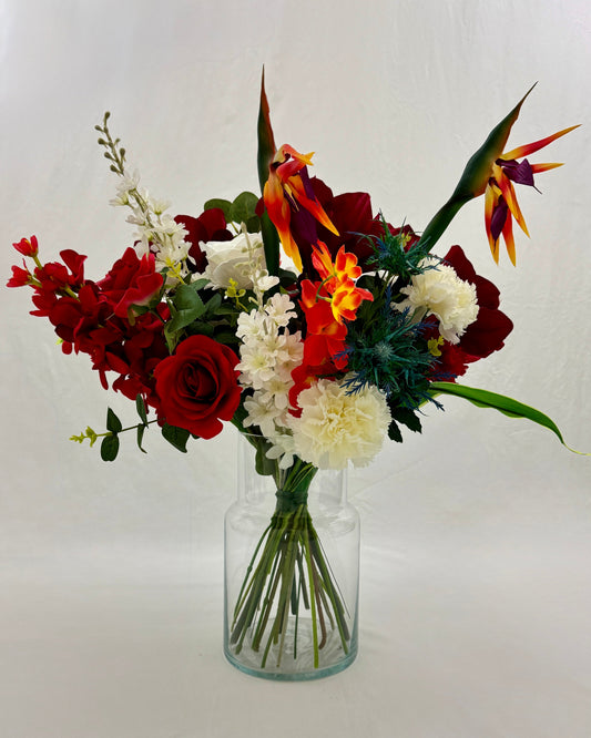 Rouwboeket met paradijsvogel
bloemen in vaas