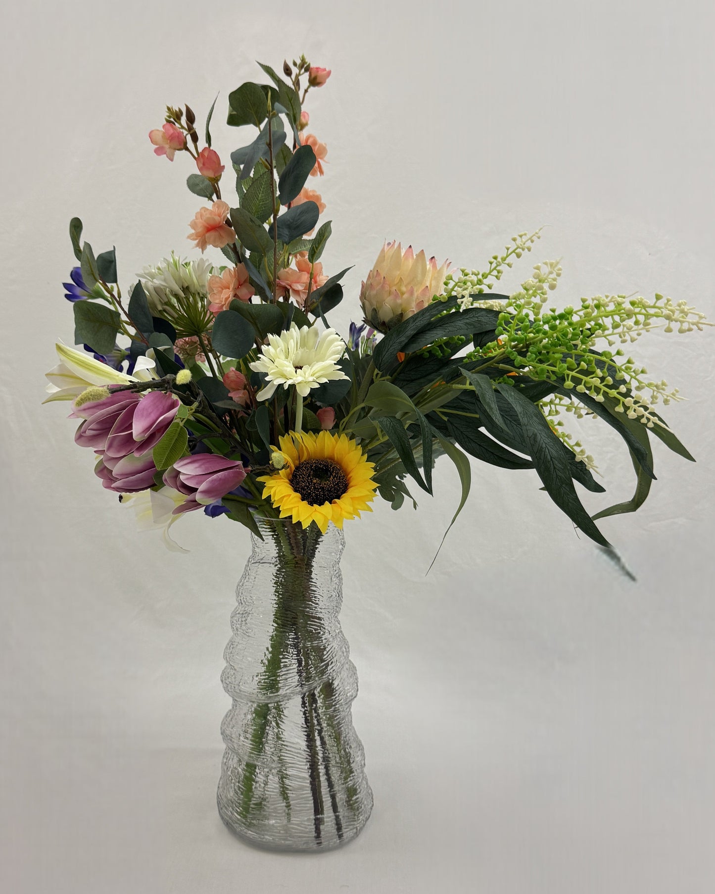 Rouwboeket in glazen vaas