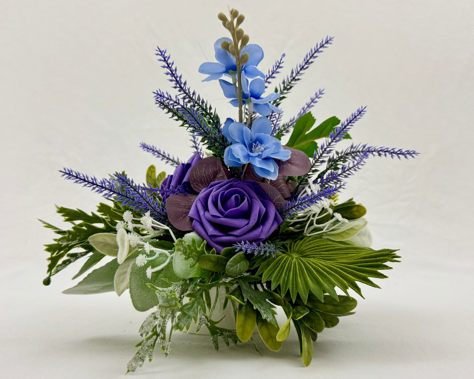 Mini rouwboeket met paarse bloemen