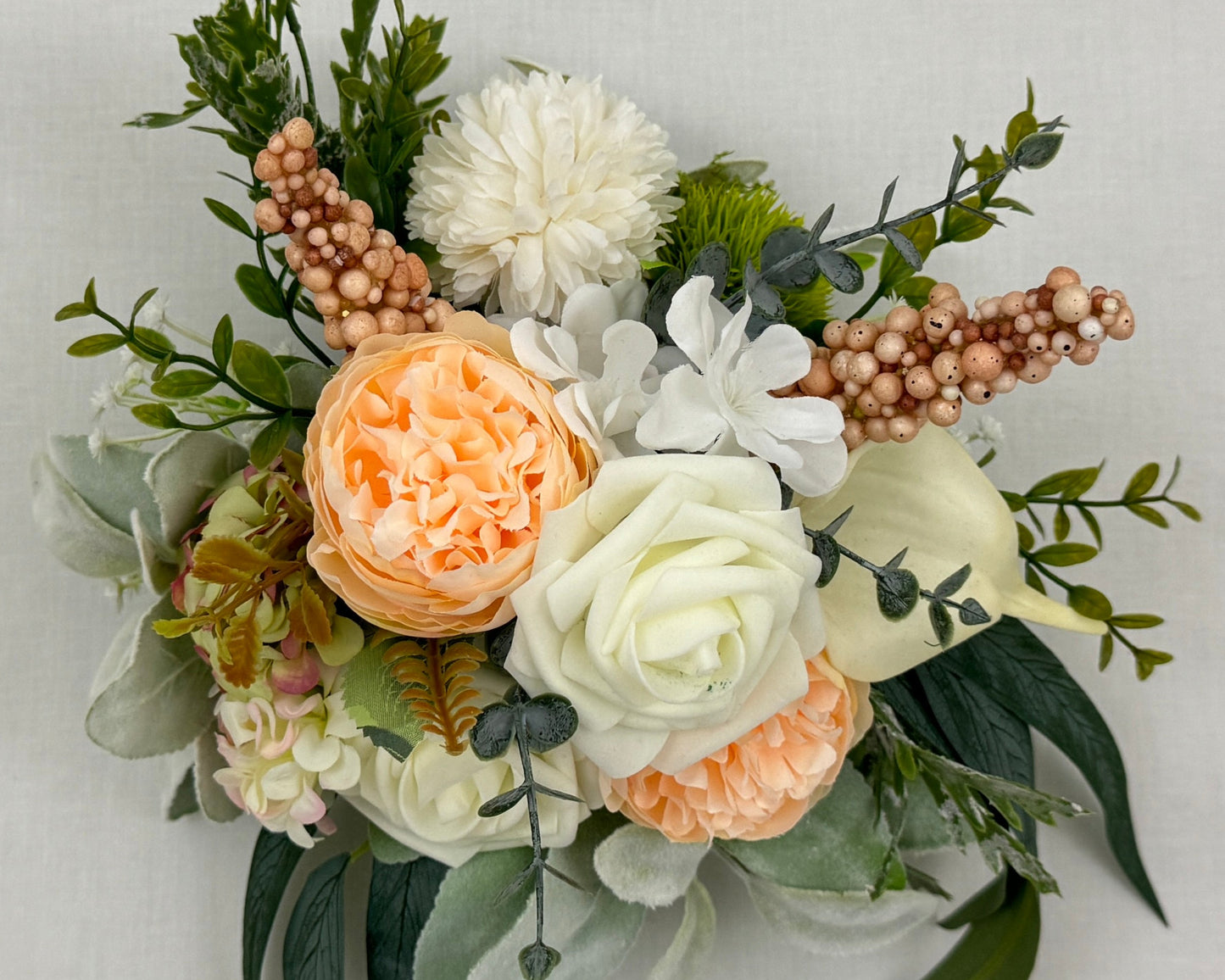 mini rouwboeket met zalmroze kleuren